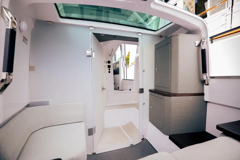 Slide: The Image of Interior of 2023 Axopar Michael Vrbas boat, featuring modern design and comfortable seating. - 17