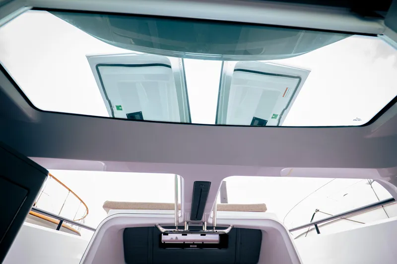 Slide: The Image of Interior view of 2023 Axopar Michael Vrbas boat with open sunroof. - 18