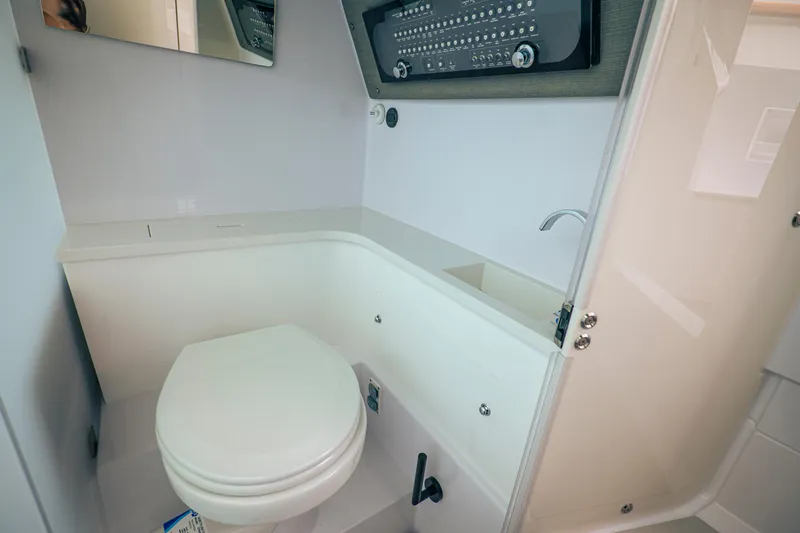Slide: The Image of 2023 Axopar Michael Vrbas boat bathroom interior with toilet and sink. - 20