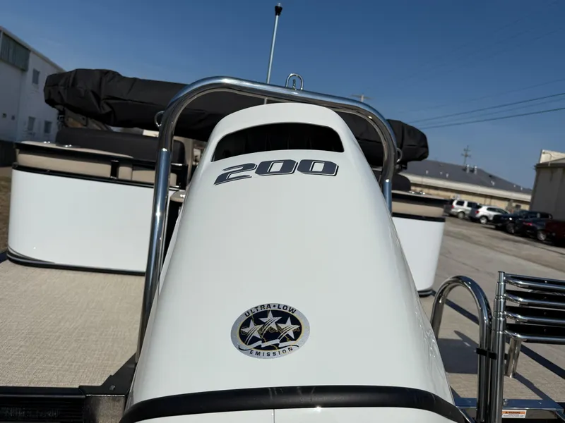 Slide: The Image of 2025 Tahoe Pontoon LTZ Quad Lounger with 200 horsepower engine, parked outdoors. - 15