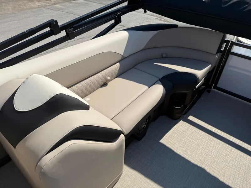 Slide: The Image of 2025 Tahoe Pontoon LTZ Quad Lounger interior with beige and black seating. - 7