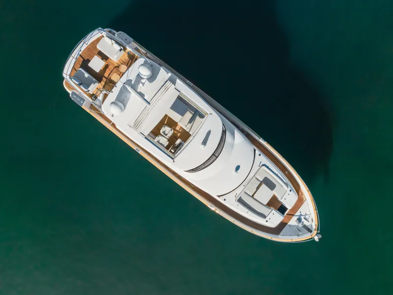 Slide: The Image of Aerial view of 2023 Azimut Magellano 66 luxury yacht on calm water. - 12