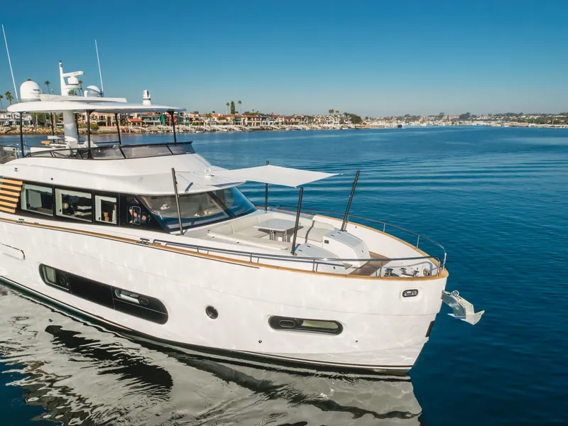 Slide: The Image of Azimut Magellano 66 yacht cruising on clear blue waters, 2023 model. - 14