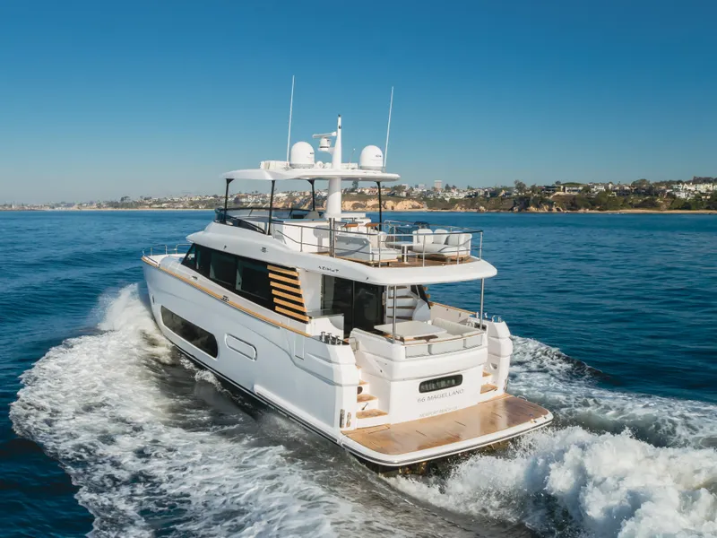 Slide: The Image of 2023 Azimut Magellano 66 yacht cruising on open water. - 17