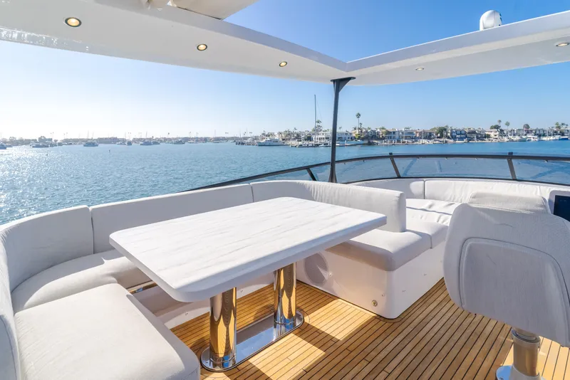 Slide: The Image of Luxurious 2023 Azimut Magellano 66 yacht deck with elegant seating and ocean view. - 22