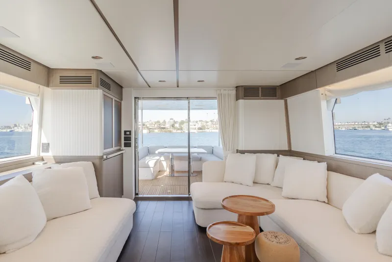 Slide: The Image of Luxurious interior of 2023 Azimut Magellano 66 yacht with elegant seating and ocean view. - 32