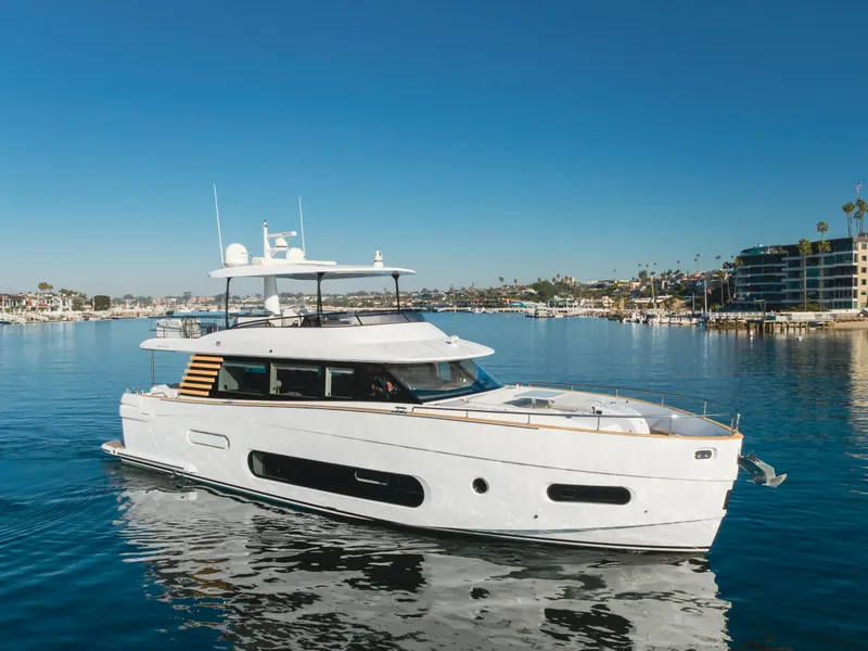 Slide: The Image of 2023 Azimut Magellano 66 yacht on calm water, clear sky background. - 5