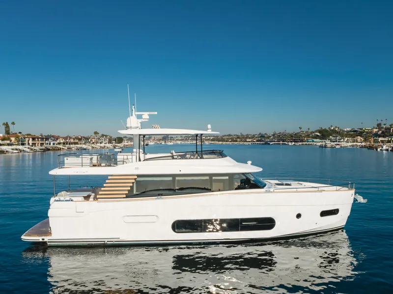 Slide: The Image of 2023 Azimut Magellano 66 yacht cruising on a sunny day. - 8