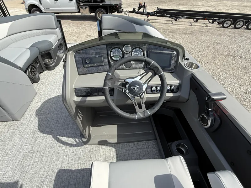 Slide: The Image of 2025 Tahoe Pontoon LTZ Quad Lounger Shift dashboard with steering wheel and controls. - 8