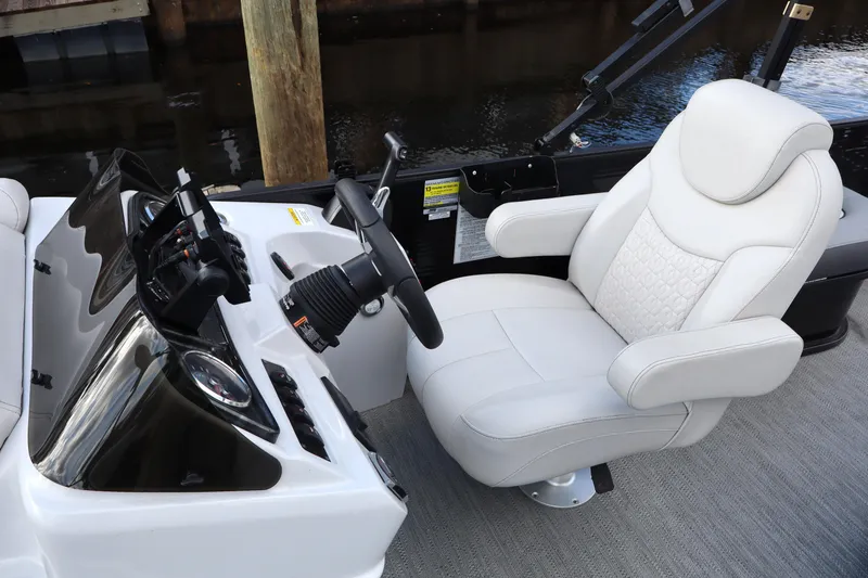 Slide: The Image of Captain's seat and console of 2022 Godfrey SWEETWATER 2286 SFL boat. - 9