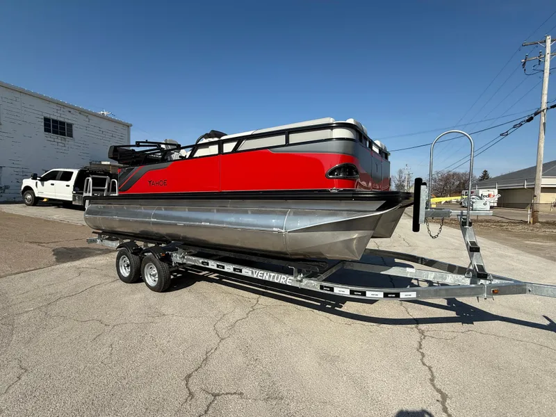 The Image of 2025 Tahoe Pontoon Sport 85 Cruise Rear Bench on trailer, red and silver design. - 0