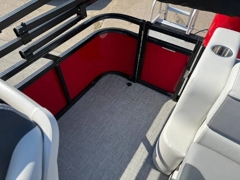 Slide: The Image of 2025 Tahoe Pontoon Sport 85 Cruise Rear Bench, red and gray interior, cup holder visible. - 5
