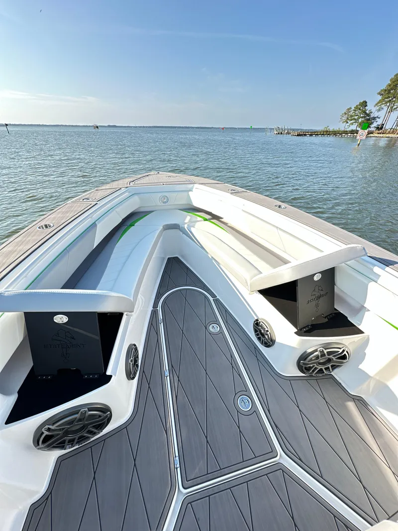 Slide: The Image of 2023 Statement 350 Open boat with sleek deck design on calm waters. - 15