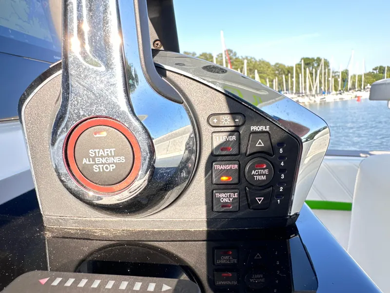 Slide: The Image of Control panel of 2023 Statement 350 Open boat with engine start button. - 23