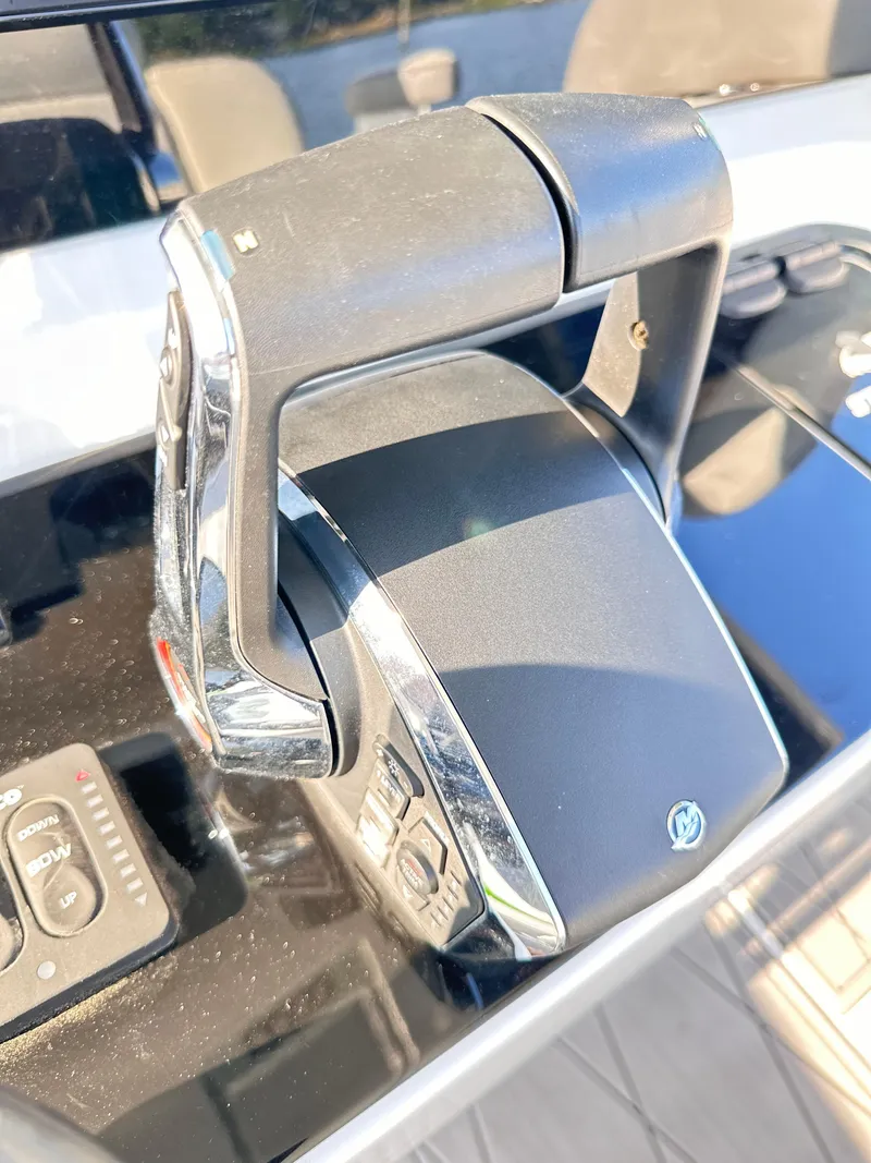 Slide: The Image of Close-up of 2023 Statement 350 Open boat throttle control. - 24