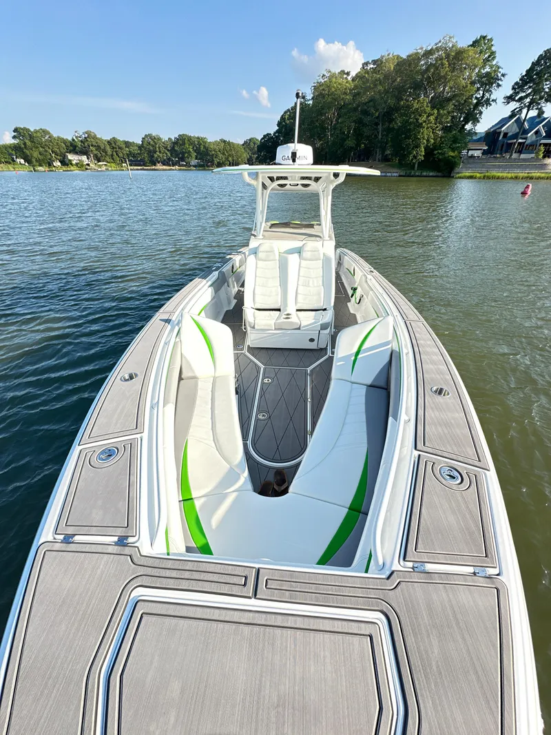 Slide: The Image of 2023 Statement 350 Open boat on a serene lake with lush greenery. - 28