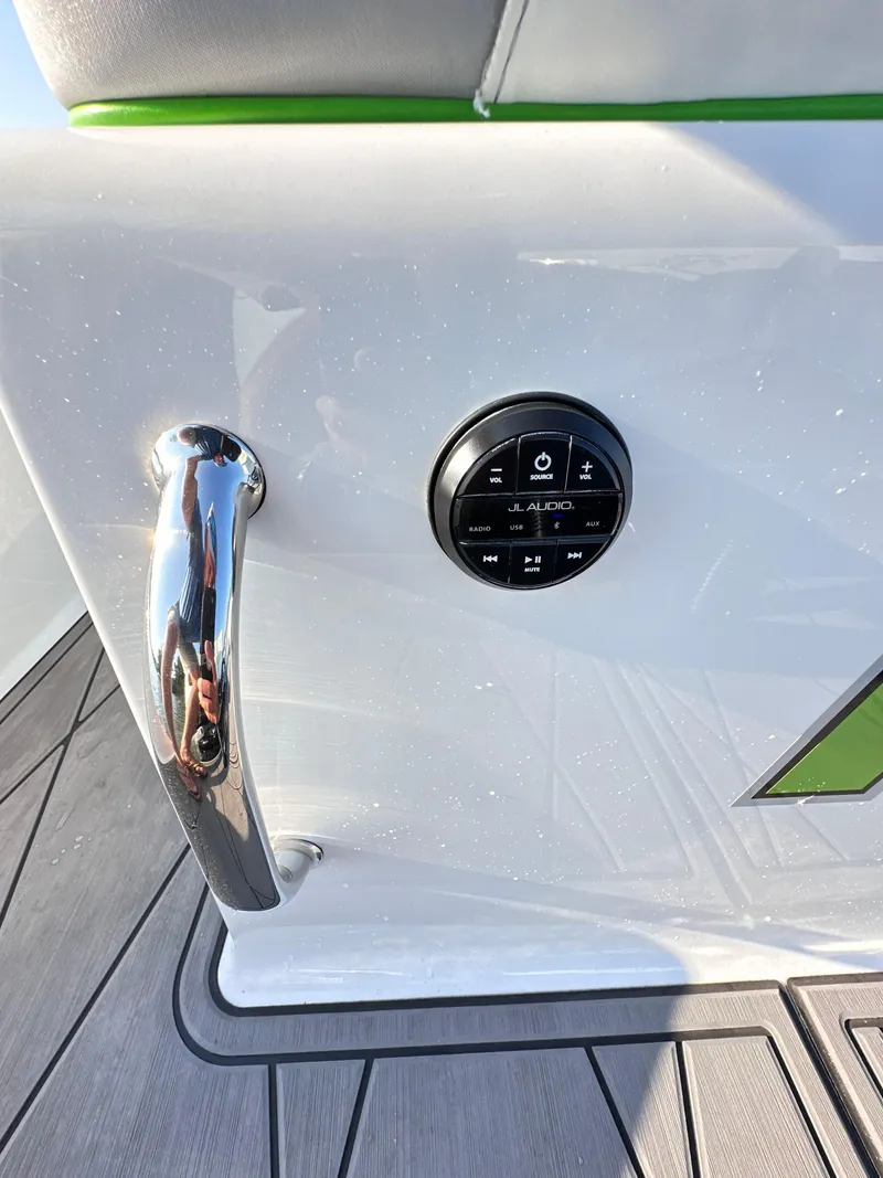Slide: The Image of 2023 Statement 350 Open boat control panel with chrome handle. - 32