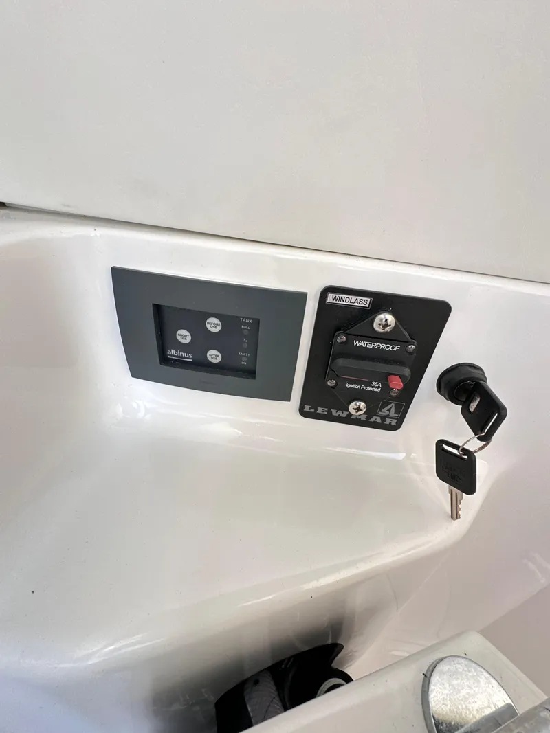 Slide: The Image of Control panel and ignition key of 2023 Statement 350 Open boat. - 34