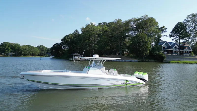 Slide: The Image of 2023 Statement 350 Open boat on a serene lake with lush greenery. - 4