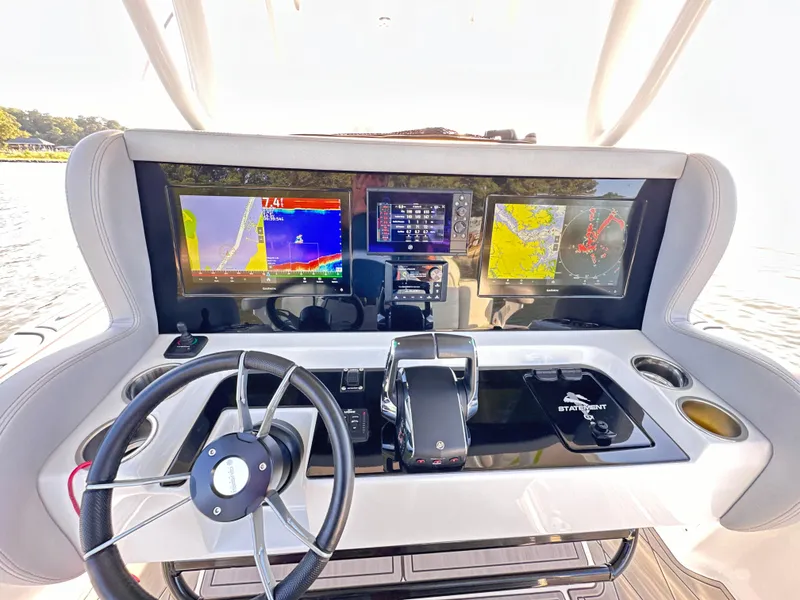Slide: The Image of Dashboard of 2023 Statement 350 Open boat with navigation screens and controls. - 6