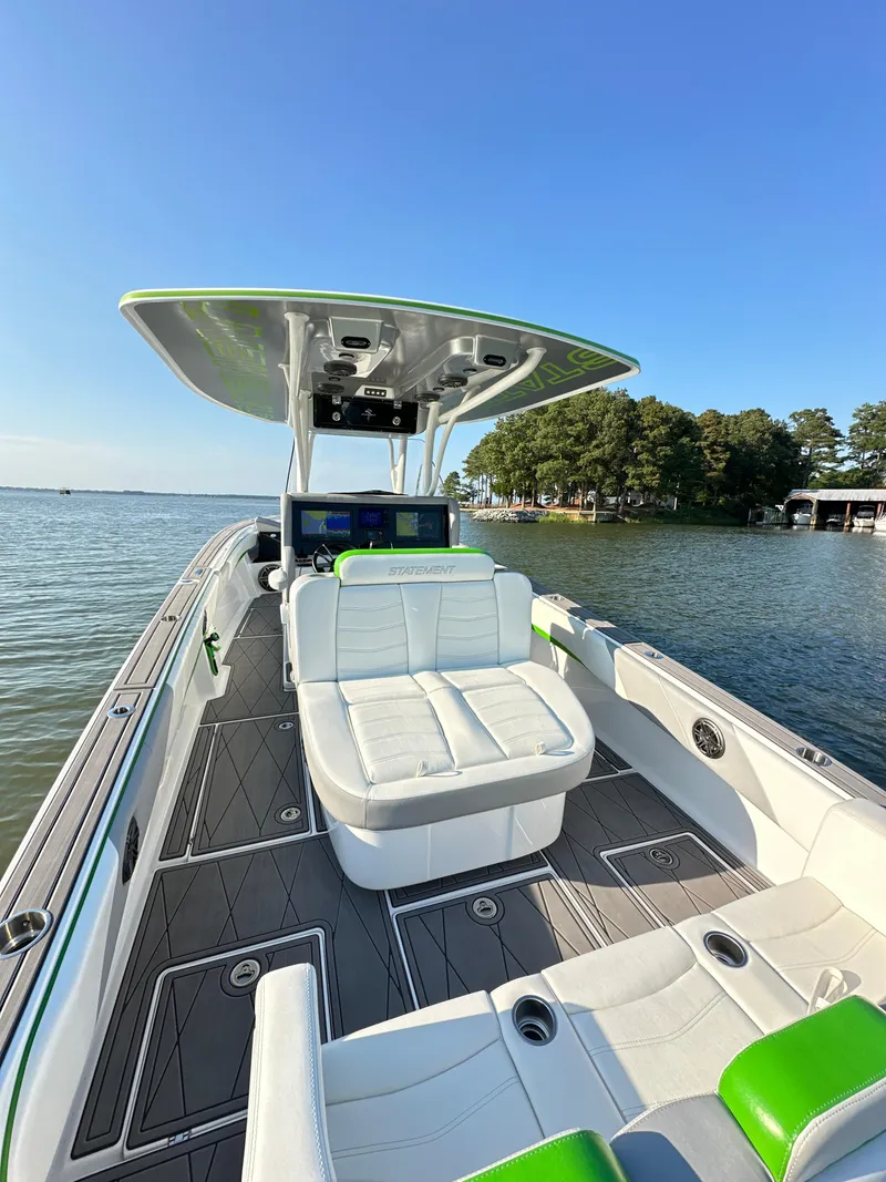Slide: The Image of 2023 Statement 350 Open boat with sleek design and spacious seating on a sunny day. - 9