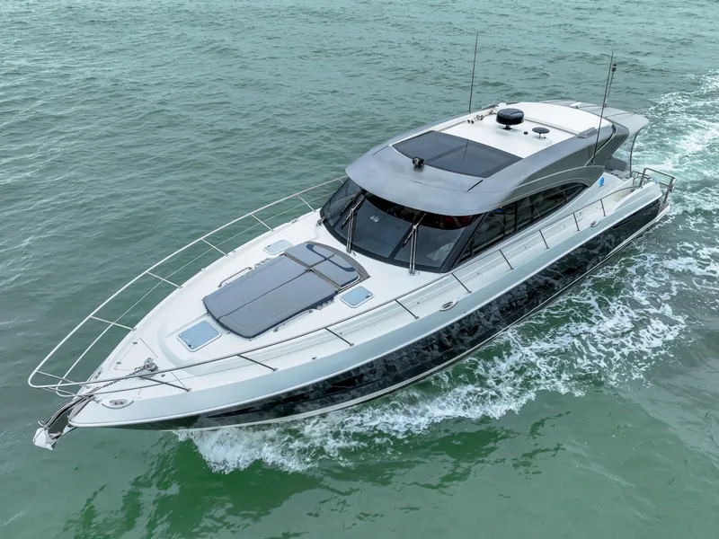 Slide: The Image of Riviera 5400 Sport Yacht 2021 cruising on open water, sleek and modern design. - 1