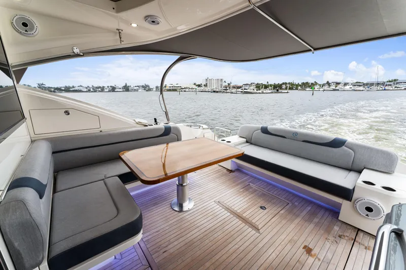 Slide: The Image of Luxurious 2021 Riviera 5400 Sport Yacht with spacious deck and waterfront view. - 21