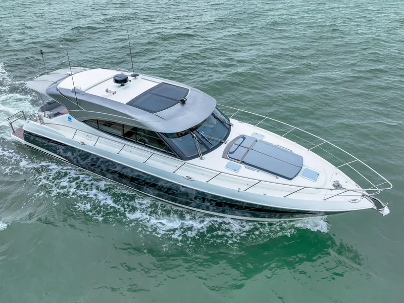 Slide: The Image of 2021 Riviera 5400 Sport Yacht cruising on open water. - 3