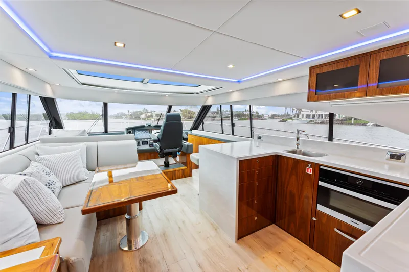 Slide: The Image of Luxurious interior of 2021 Riviera 5400 Sport Yacht with modern kitchen and seating area. - 37