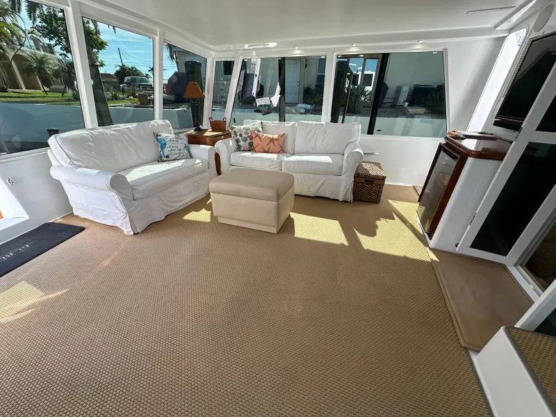 Slide: The Image of Spacious interior of 1999 Viking 60 Cockpit Sports Yacht with comfortable seating. - 10