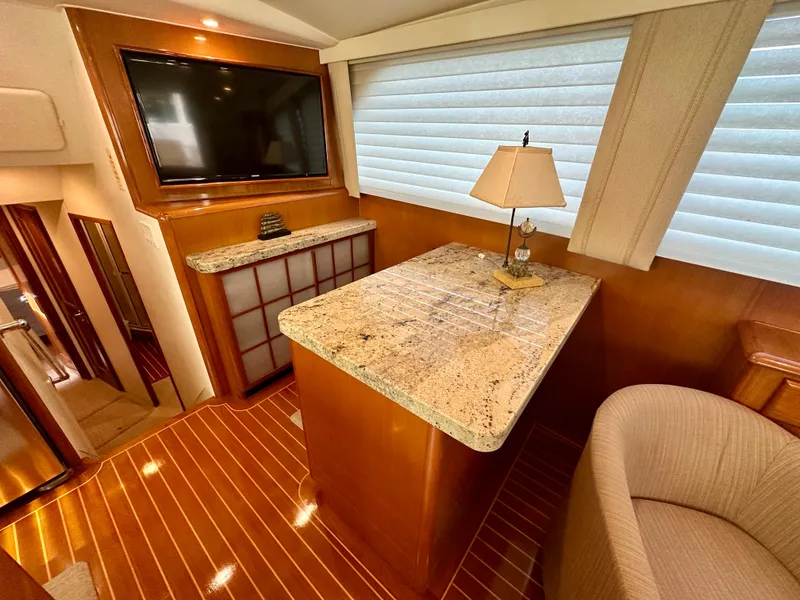 Slide: The Image of Luxurious interior of 1999 Viking 60 Cockpit Sports Yacht with granite countertop and elegant decor. - 22