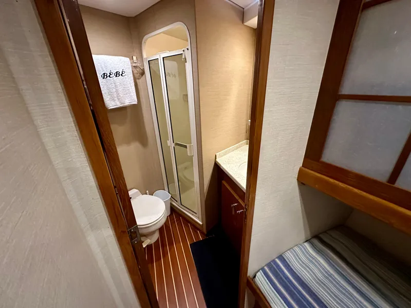 Slide: The Image of Bathroom interior of 1999 Viking 60 Cockpit Sports Yacht with shower and toilet. - 27