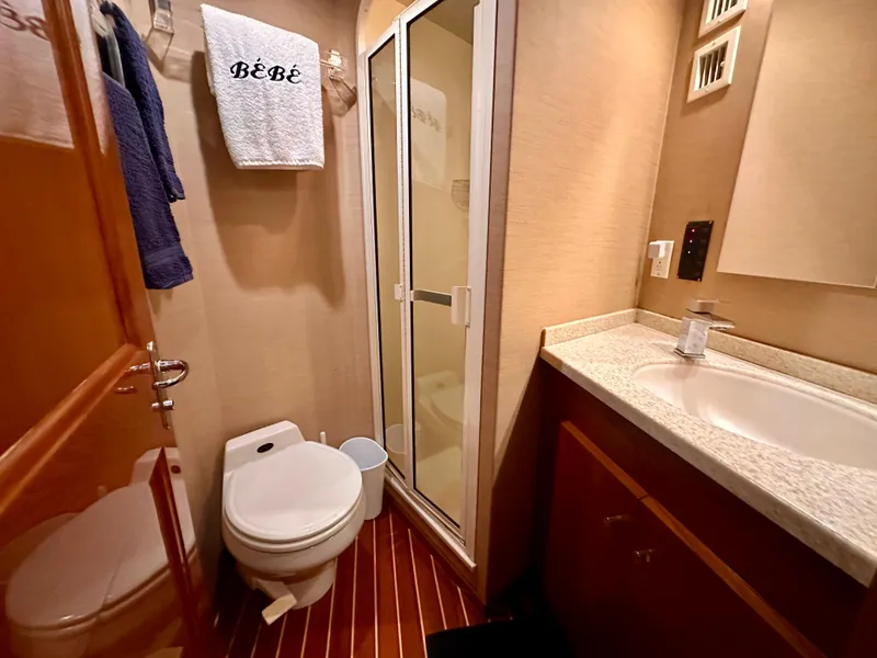 Slide: The Image of Bathroom interior of 1999 Viking 60 Cockpit Sports Yacht with shower and sink. - 28
