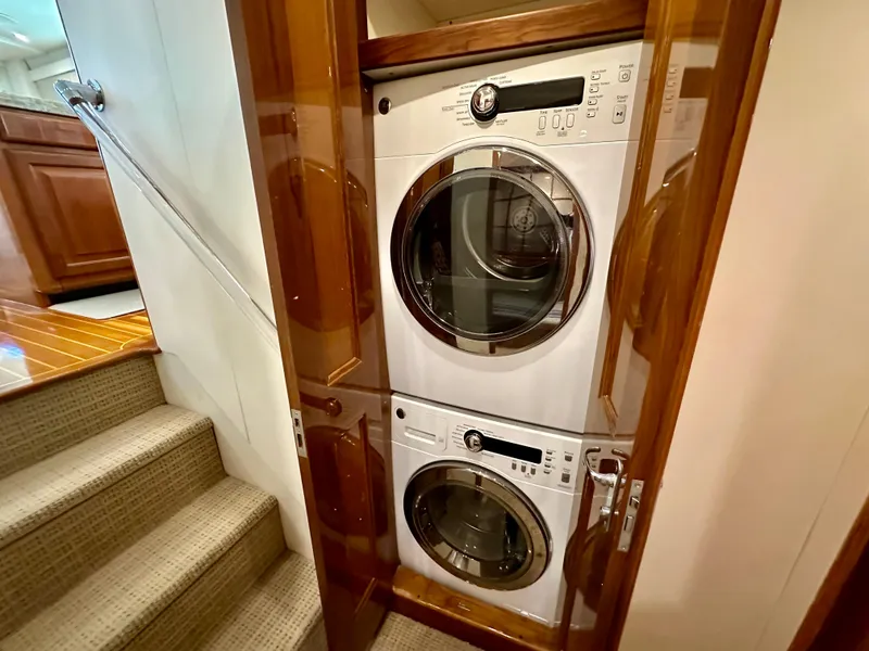 Slide: The Image of Stacked washer and dryer in 1999 Viking 60 Cockpit Sports Yacht laundry area. - 29