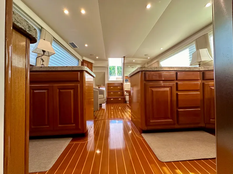 Slide: The Image of Luxurious interior of 1999 Viking 60 Cockpit Sports Yacht with polished wood and elegant cabinetry. - 34