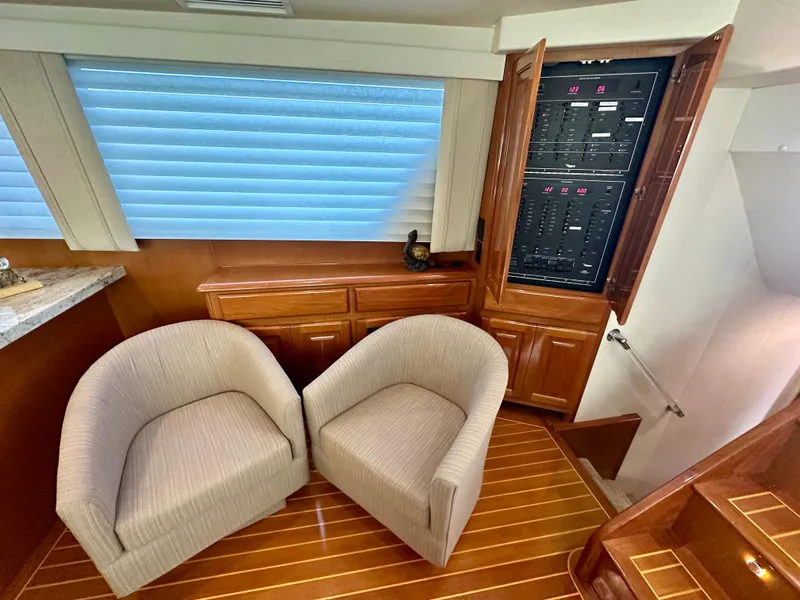 Slide: The Image of Interior of 1999 Viking 60 Cockpit Sports Yacht with chairs and control panel. - 35