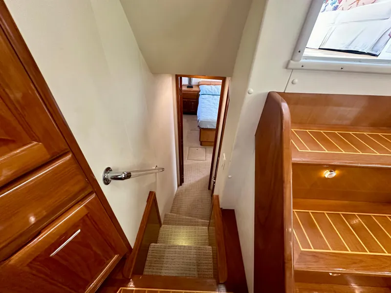 Slide: The Image of Staircase leading to cabin in 1999 Viking 60 Cockpit Sports Yacht interior. - 36
