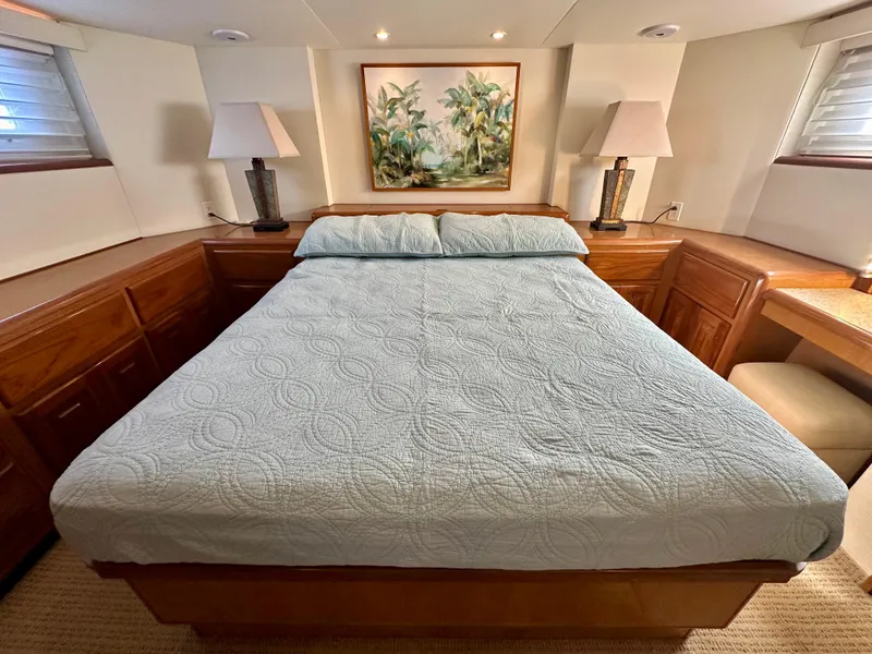 Slide: The Image of Luxurious bedroom in 1999 Viking 60 Cockpit Sports Yacht with elegant decor and cozy bedding. - 38