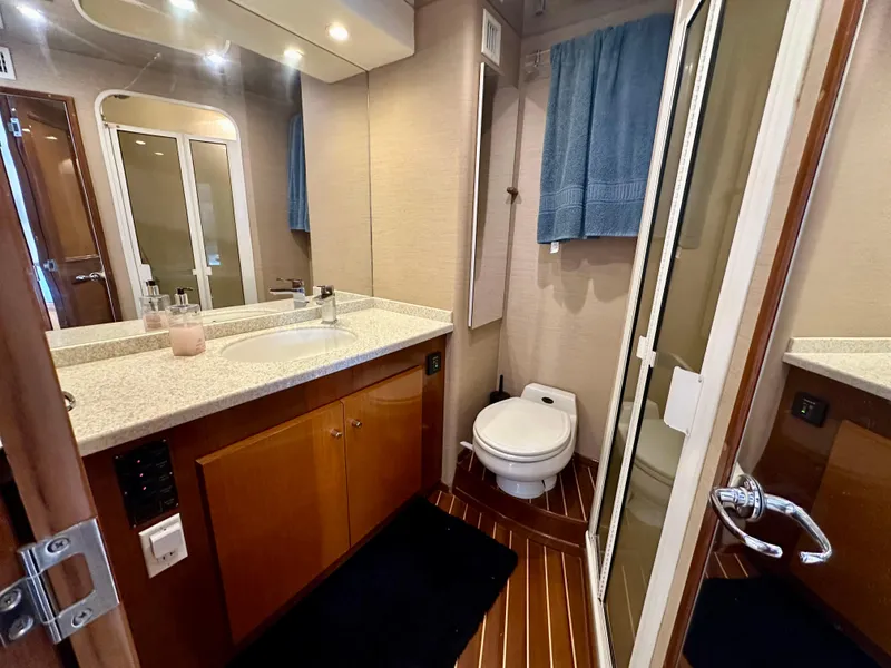 Slide: The Image of Bathroom interior of 1999 Viking 60 Cockpit Sports Yacht with modern amenities. - 40