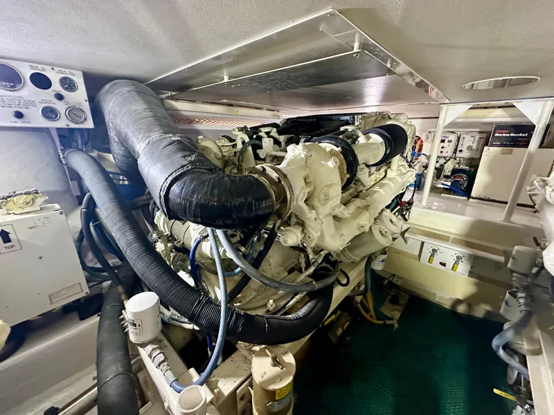 Slide: The Image of Engine room of 1999 Viking 60 Cockpit Sports Yacht with visible machinery and components. - 43