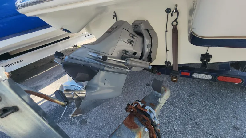 Slide: The Image of 2005 Larson LXi 208 boat engine and trailer hitch close-up. - 14