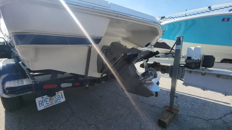 Slide: The Image of 2005 Larson LXi 208 boat on trailer, rear view, sunny day. - 15