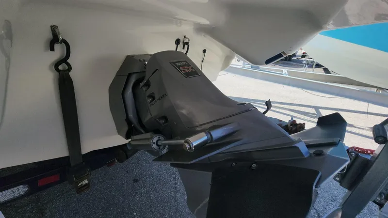 Slide: The Image of 2005 Larson LXi 208 boat engine close-up, showcasing the outboard motor and propeller area. - 16