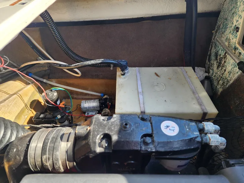Slide: The Image of Engine compartment of a 2005 Larson LXi 208 boat, showing components and wiring. - 24