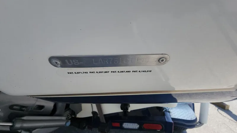 Slide: The Image of 2005 Larson LXi 208 boat hull identification number plate. - 27