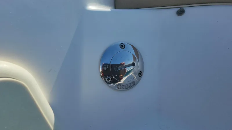 Slide: The Image of Close-up of a 2005 Larson LXi 208 boat fuel cap. - 32