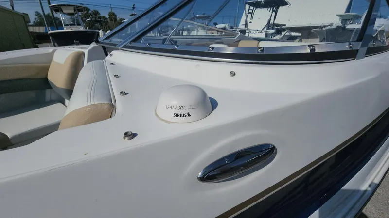 Slide: The Image of 2005 Larson LXi 208 boat with Sirius antenna on deck. - 9