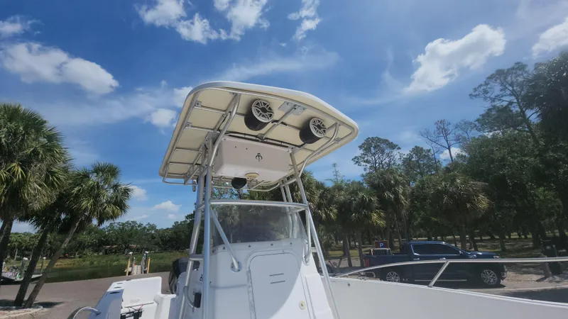 Slide: The Image of 2003 Pro-Line 22 boat with T-top under a clear blue sky. - 11