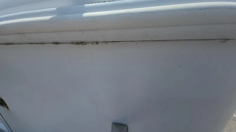 Slide: The Image of 2003 Pro-Line 22 boat hull, showing wear and discoloration. - 23