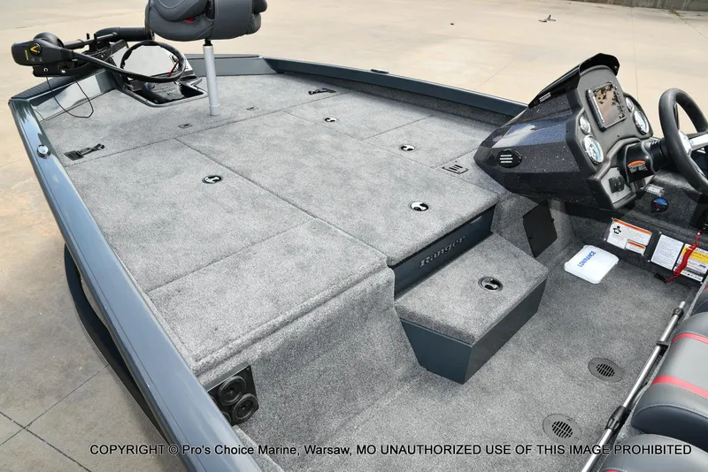 Slide: The Image of 2024 Ranger RT188P boat interior with carpeted deck and control console. - 11